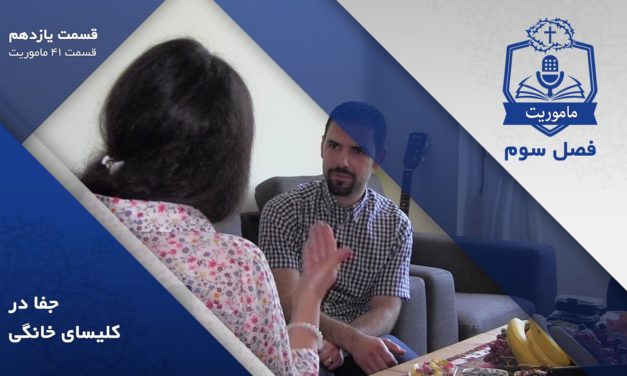 Two people engaged in a serious conversation indoors.
