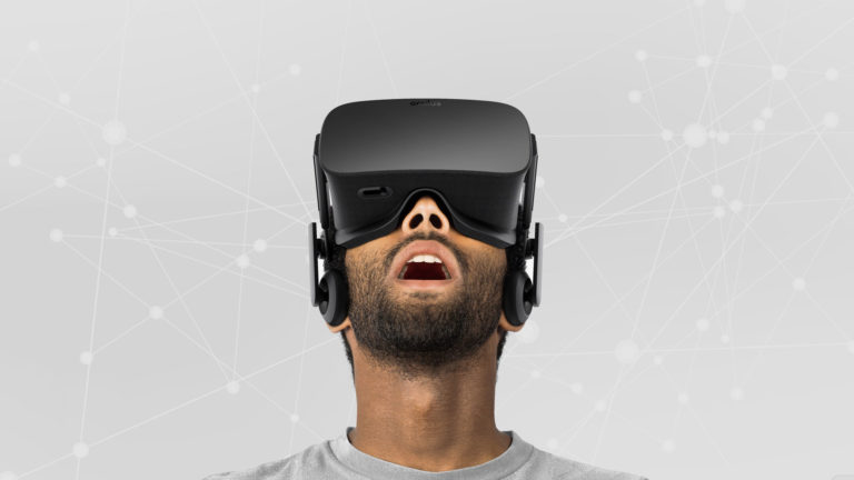 Man experiencing virtual reality with VR headset, amazed.