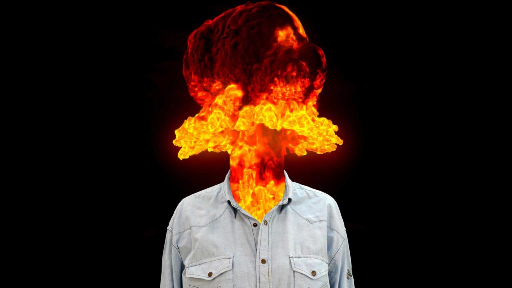 Person with a head replaced by a fiery explosion.