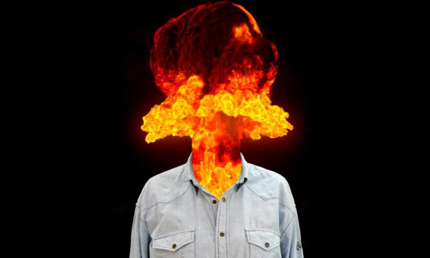 Person with a head replaced by a fiery explosion.