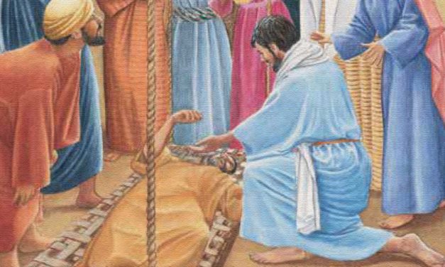 A man in robes tending to a lion in a ancient setting.