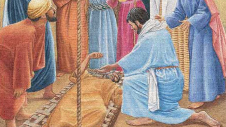 A man in robes tending to a lion in a ancient setting.