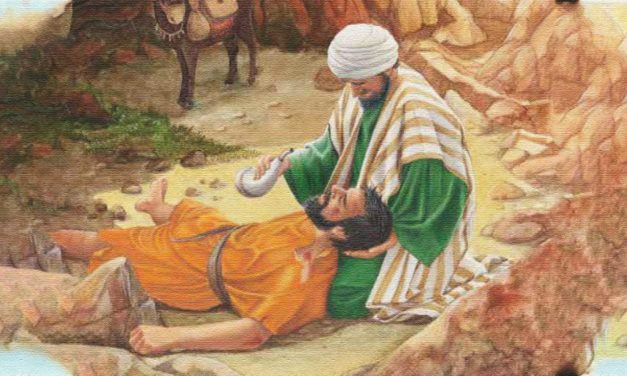 A person dressed in traditional attire tending to a wounded individual lying on the ground.