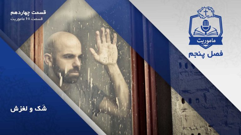 Man gazing pensively through a rain-speckled window.