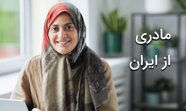 Smiling woman in a headscarf poses indoors with soft natural light.